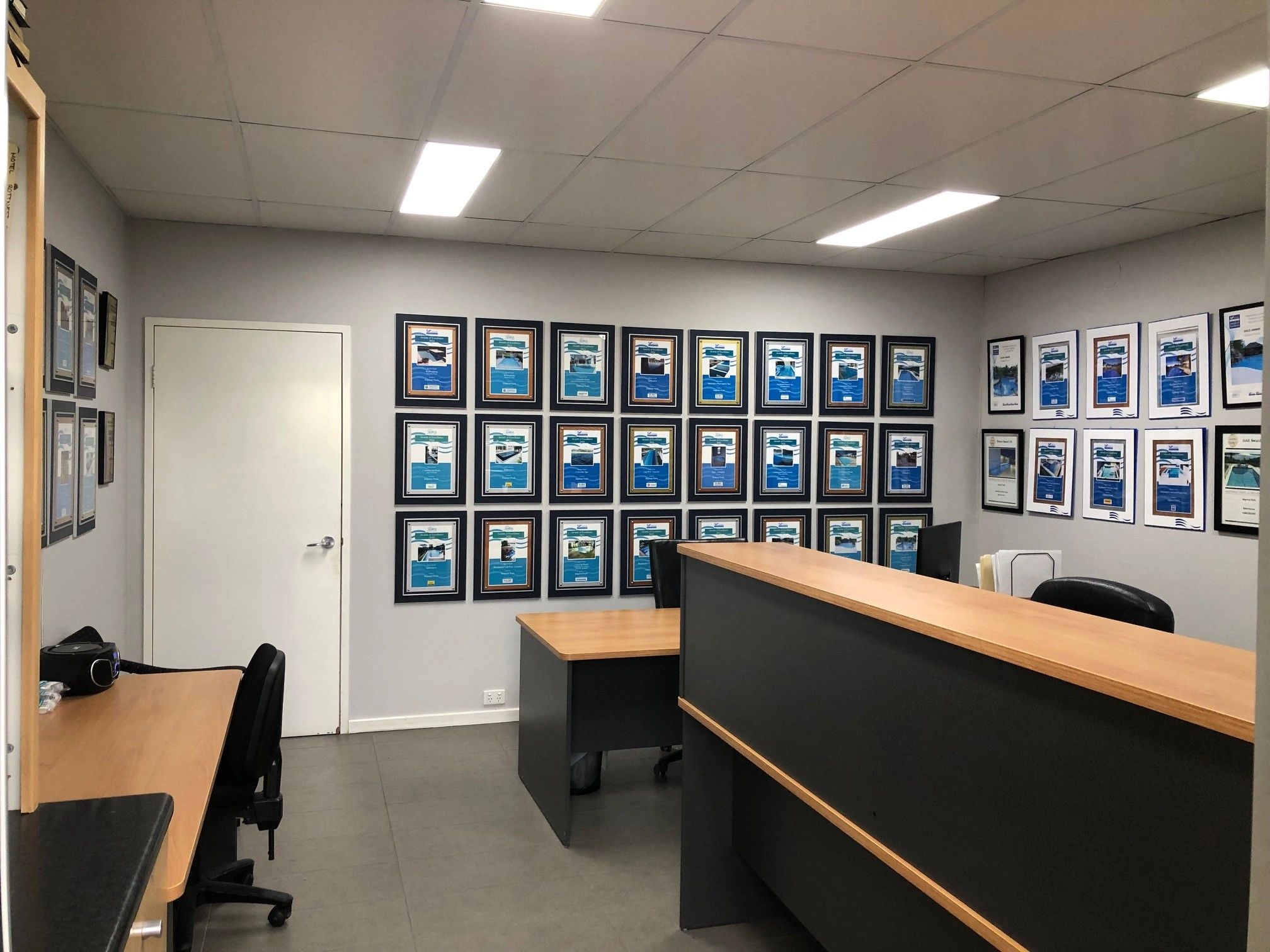 Imperial Pools office with awards